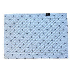 Reversible quilted cotton placemat in Lauris Light Yellow by Marat d’Avignon, featuring a white center with lavender purple floral medallions and a border of lavender sprigs and olive branches, with a white reverse side  scattered with tiny lavender  blossoms, crafted in Provence.