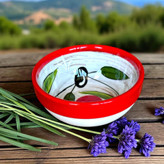Mini ceramic bowl with red rim and white base, hand-painted with black olives and green leaves; measures 3¾ inches in diameter and 1¾ inches high, ideal for condiments or small servings.
