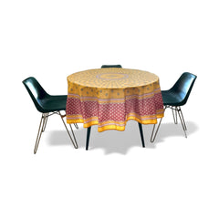 Round coated cotton tablecloth in golden yellow and deep red, featuring concentric Provençal floral and geometric patterns