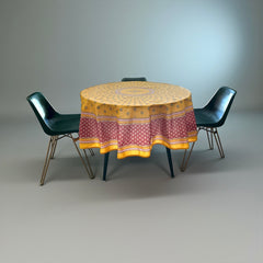 Round coated cotton tablecloth in golden yellow and deep red, featuring concentric Provençal floral and geometric patterns