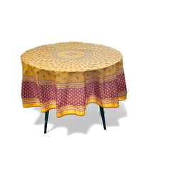 Round coated cotton tablecloth in golden yellow and deep red, featuring concentric Provençal floral and geometric patterns