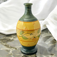 Handmade ceramic oil bottle or vase from Provence, featuring a yellow glaze with green accents and hand-painted white floral motif, signed Bleu d’Argile France