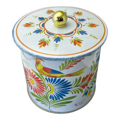 Round cookie tin box in Quimper designs, available in Floral or Rooster patterns. Cylindrical tin with a moisture-absorbing lid for keeping cookies fresh. Perfect for adding a French country charm to your kitchen.