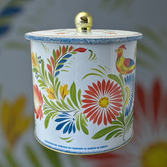 Round cookie tin box in Quimper designs, available in Floral or Rooster patterns. Cylindrical tin with a moisture-absorbing lid for keeping cookies fresh. Perfect for adding a French country charm to your kitchen.