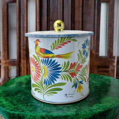 Round cookie tin box in Quimper designs, available in Floral or Rooster patterns. Cylindrical tin with a moisture-absorbing lid for keeping cookies fresh. Perfect for adding a French country charm to your kitchen.