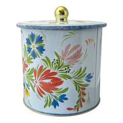 Round cookie tin box in Quimper designs, available in Floral or Rooster patterns. Cylindrical tin with a moisture-absorbing lid for keeping cookies fresh. Perfect for adding a French country charm to your kitchen.