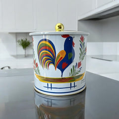 Round cookie tin box in Quimper designs, available in Floral or Rooster patterns. Cylindrical tin with a moisture-absorbing lid for keeping cookies fresh. Perfect for adding a French country charm to your kitchen.
