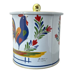 Round cookie tin box in Quimper designs, available in Floral or Rooster patterns. Cylindrical tin with a moisture-absorbing lid for keeping cookies fresh. Perfect for adding a French country charm to your kitchen.
