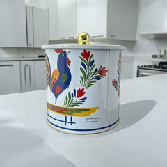 Round cookie tin box in Quimper designs, available in Floral or Rooster patterns. Cylindrical tin with a moisture-absorbing lid for keeping cookies fresh. Perfect for adding a French country charm to your kitchen.