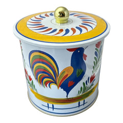Round cookie tin box in Quimper designs, available in Floral or Rooster patterns. Cylindrical tin with a moisture-absorbing lid for keeping cookies fresh. Perfect for adding a French country charm to your kitchen.
