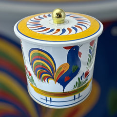 Round cookie tin box in Quimper designs, available in Floral or Rooster patterns. Cylindrical tin with a moisture-absorbing lid for keeping cookies fresh. Perfect for adding a French country charm to your kitchen.