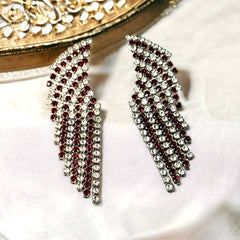 Vintage 1980s sparkly earrings with red and clear prong-set rhinestones, silver tone metal, waterfall drop design, and posts for pierced ears. High-quality craftsmanship with an elegant and glamorous look, perfect for special events and evening wear.