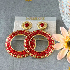 Vintage 1980s red enamel and gold‑tone circle dangle post earrings with pressed scroll and Greek key design on original Impressions card.