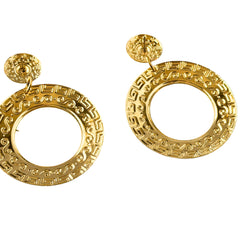 Vintage 1980s red enamel and gold‑tone circle dangle post earrings with pressed scroll and Greek key design on original Impressions card.