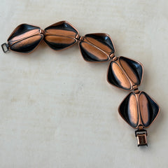 Vintage Renoir Modernist copper bracelet with geometric diamond‑shaped links and fold‑over clasp, signed Renoir.