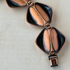 Vintage Renoir Modernist copper bracelet with geometric diamond‑shaped links and fold‑over clasp, signed Renoir.