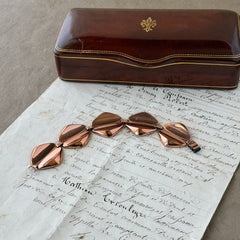 Vintage Renoir Modernist copper bracelet with geometric diamond‑shaped links and fold‑over clasp, signed Renoir.
