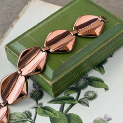 Vintage Renoir Modernist copper bracelet with geometric diamond‑shaped links and fold‑over clasp, signed Renoir.