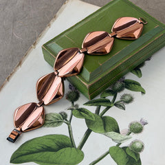 Vintage Renoir Modernist copper bracelet with geometric diamond‑shaped links and fold‑over clasp, signed Renoir.