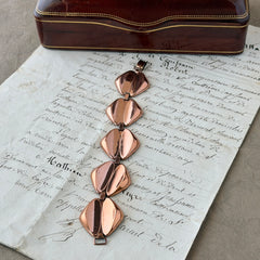 Vintage Renoir Modernist copper bracelet with geometric diamond‑shaped links and fold‑over clasp, signed Renoir.