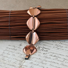 Vintage Renoir Modernist copper bracelet with geometric diamond‑shaped links and fold‑over clasp, signed Renoir.