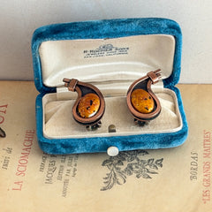 Vintage Matisse Renoir copper clip‑on earrings with orange sugar‑textured art‑glass cabochons.