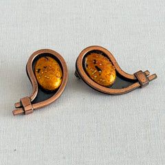 Vintage Matisse Renoir copper clip‑on earrings with orange sugar‑textured art‑glass cabochons.
