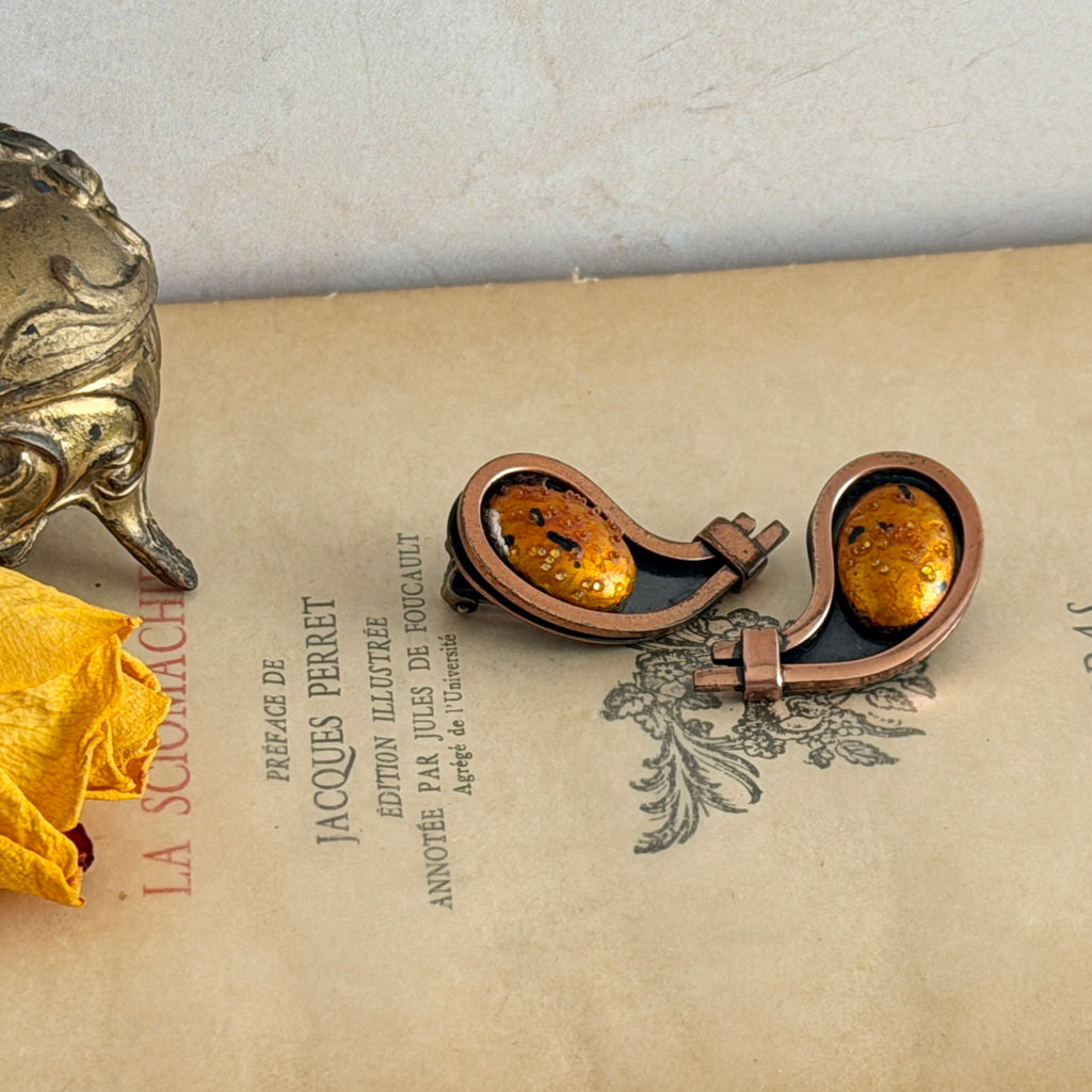 Vintage Matisse Renoir copper clip‑on earrings with orange sugar‑textured art‑glass cabochons.
