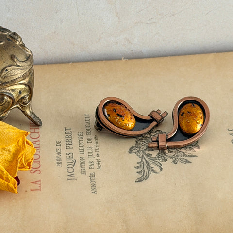 Vintage Matisse Renoir copper clip‑on earrings with orange sugar‑textured art‑glass cabochons.