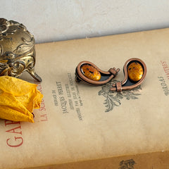 Vintage Matisse Renoir copper clip‑on earrings with orange sugar‑textured art‑glass cabochons.