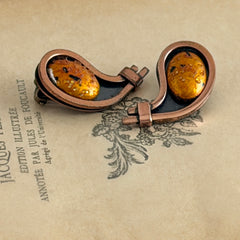 Vintage Matisse Renoir copper clip‑on earrings with orange sugar‑textured art‑glass cabochons.