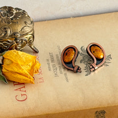 Vintage Matisse Renoir copper clip‑on earrings with orange sugar‑textured art‑glass cabochons.