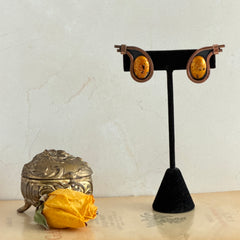 Vintage Matisse Renoir copper clip‑on earrings with orange sugar‑textured art‑glass cabochons.
