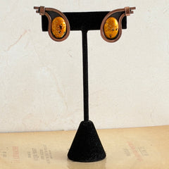 Vintage Matisse Renoir copper clip‑on earrings with orange sugar‑textured art‑glass cabochons.
