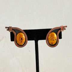 Vintage Matisse Renoir copper clip‑on earrings with orange sugar‑textured art‑glass cabochons.