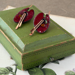 Vintage Matisse Renoir red enamel and copper artist palette earrings with miniature paintbrush design, mid‑century modern clip‑ons from the 1950s–1960s.