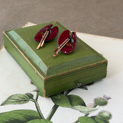Vintage Matisse Renoir red enamel and copper artist palette earrings with miniature paintbrush design, mid‑century modern clip‑ons from the 1950s–1960s.