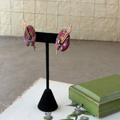 Vintage Matisse Renoir red enamel and copper artist palette earrings with miniature paintbrush design, mid‑century modern clip‑ons from the 1950s–1960s.