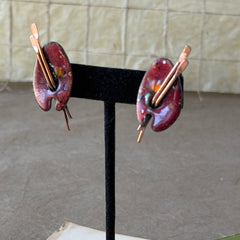 Vintage Matisse Renoir red enamel and copper artist palette earrings with miniature paintbrush design, mid‑century modern clip‑ons from the 1950s–1960s.