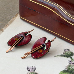 Vintage Matisse Renoir red enamel and copper artist palette earrings with miniature paintbrush design, mid‑century modern clip‑ons from the 1950s–1960s.