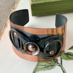 Vintage Modernist copper cuff bracelet with geometric raised design and oxidized black accents, Renoir style, mid‑century Modernist jewelry.