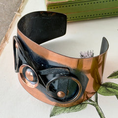 Vintage Modernist copper cuff bracelet with geometric raised design and oxidized black accents, Renoir style, mid‑century Modernist jewelry.