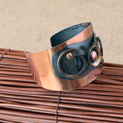 Vintage Modernist copper cuff bracelet with geometric raised design and oxidized black accents, Renoir style, mid‑century Modernist jewelry.