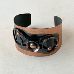 Vintage Modernist copper cuff bracelet with geometric raised design and oxidized black accents, Renoir style, mid‑century Modernist jewelry.