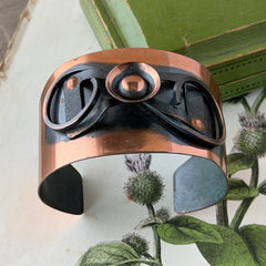 Vintage Modernist copper cuff bracelet with geometric raised design and oxidized black accents, Renoir style, mid‑century Modernist jewelry.