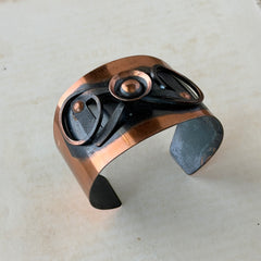 Vintage Modernist copper cuff bracelet with geometric raised design and oxidized black accents, Renoir style, mid‑century Modernist jewelry.