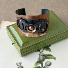 Vintage Modernist copper cuff bracelet with geometric raised design and oxidized black accents, Renoir style, mid‑century Modernist jewelry.