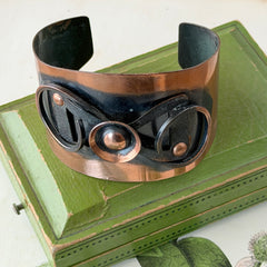 Vintage Modernist copper cuff bracelet with geometric raised design and oxidized black accents, Renoir style, mid‑century Modernist jewelry.