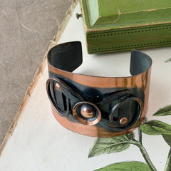 Vintage Modernist copper cuff bracelet with geometric raised design and oxidized black accents, Renoir style, mid‑century Modernist jewelry.