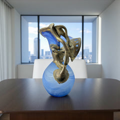 Signed Romanian handblown art glass vase from the 1990s featuring swirling blue glass and sculptural bronze overlay with organic vine-like forms. The vase has a flared top, narrow base, and an undeciphered artist’s signature etched into the glass. A collectible decorative piece in very good vintage condition.